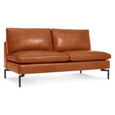 a brown leather couch with black legs