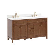 a double sink vanity with two gold faucets on the top and white counter tops