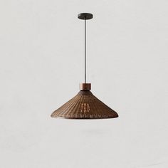 a brown light hanging from a ceiling fixture