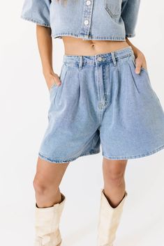 the perfect summer outfit exists, + it’s this iconic denim-on-denim moment. comprised of a boxy short sleeve denim top + matching pleated denim shorts, this casual two-piece set serves some serious 90s nostalgia. whether worn together or separately, it’s a set you can count on to slay the day. light denim // collared, buttons, cropped, front breast pocket, high waisted, one button fly zip, belt loops, pockets, pleat detailing model is 5'8" + wearing a small measurements are approximate + taken w Medium Wash Button-up Denim Top With Buttoned Pockets, Medium Wash Button-up Denim Shorts, Washed Blue Relaxed Fit Button-up Denim Top, Medium Wash Denim Top With Pockets, Short Sleeve, Medium Wash Denim Button-up Top With Pockets, Short Sleeve Denim, Slay The Day, Pleated Denim, Denim Set