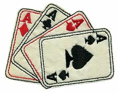 three playing cards with red and black designs on them