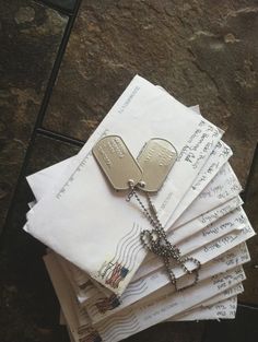 a stack of mail with two tags attached to it