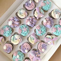 cupcakes decorated with pastel colors and mermaid decorations