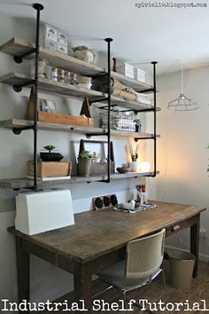 a wooden table topped with lots of shelves