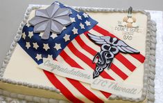 a cake decorated with an american flag and a stethoscope on the side