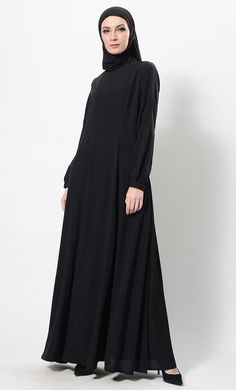 Sober Sublime Abaya Dress And Hijab Set - EastEssence.com Flowy Maxi-length Abaya For Eid, Long Sleeve Modest Abaya With Modesty Panel, Modest Long Sleeve Abaya With Modesty Panel, Modest Flowy Maxi Length Abaya, Solid Long Sleeve Maxi Dress For Eid, Modest Long Sleeve Thobe With Modesty Panel, Modest Floor-length Abaya, Solid Long Sleeve Dresses For Eid, Modest Solid Color Floor-length Abaya