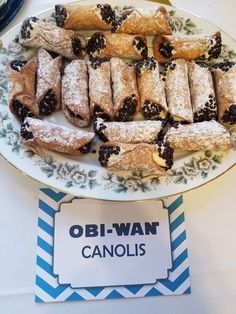 a plate with pastries on it and a sign that says obi - wan candies