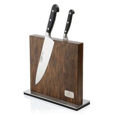 a wooden block with two knives in it