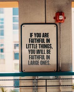 a sign on the side of a building that says if you are faithful in little things, you will be faithful in large ones