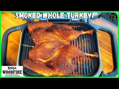 there is a chicken on the grill with words that say, smoked whole turkey?