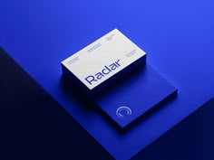 a business card sitting on top of a blue surface with the word radar printed on it