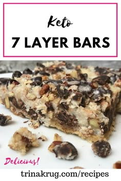 a close up of a plate of food with the words keto 7 layer bars