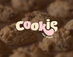 cookies with the word cookie written in pink on top and bottom, surrounded by other cookies