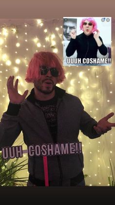 a man with pink hair and sunglasses making the peace sign while standing in front of lights