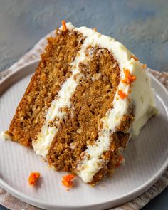 a slice of carrot cake on a white plate