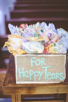 a box filled with flowers sitting on top of a table