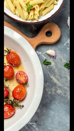 pasta with tomatoes and herbs in a white bowl