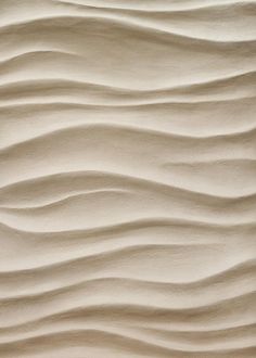 the sand is wavy and white in color