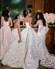 the bridesmaids are getting ready to walk down the aisle in their wedding dresses