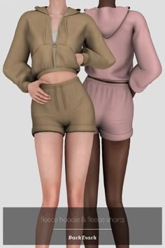 two women in shorts and hoodies standing next to each other