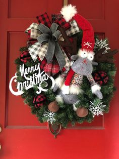 a christmas wreath hanging on the front door