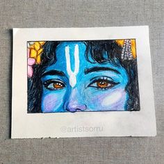 a drawing of the face of lord rama on a piece of paper with colored pencils