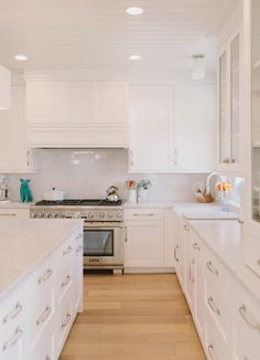 the kitchen is clean and ready for us to use it's white counter tops