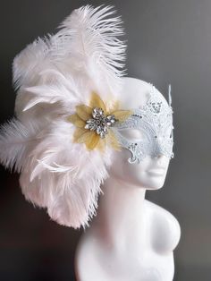 Our women's white laser cut metal masquerade mask, adorned with delicate white feathers and a gold crystal brooch, offers you the opportunity to add a touch of enchanting gold glitter to the mask. Whether you're attending a grand masquerade ball, a themed gala, or simply looking to add a touch of elegance to your attire, this mask ensures you'll be the center of attention. Age Group/Gender - Adult/Women Size/Type - One size fits all adults Mask Color - White Mask Material - Laser cut metal Elegant White Masquerade Mask For Carnival, Elegant White Masquerade Mask For Mardi Gras, Elegant Feathered Masquerade Mask For Mardi Gras, White Eye Mask For Masquerade, White Masks For Carnival Party, Elegant White Eye Mask, White Mardi Gras Masquerade Masks, White Party Masks For Carnival, White Carnival Party Mask