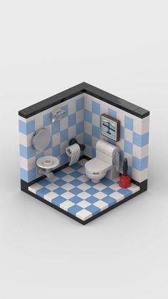 a blue and white checkered bathroom with two toilets in the corner, next to a toilet paper dispenser