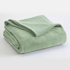 a green towel folded on top of each other