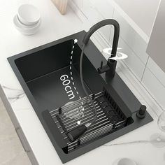 a kitchen sink that has the number 600 on it and is connected to a faucet