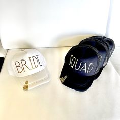 Super Cute And Fun Hats Bought For A Bachelorette Party That Didn’t Go Ahead. Gold Bride And Squad Lettering On Front And A Gold Pineapple On The Bill. 5 Pieces In Total. There Are 4 Squad Hats And 1 Bride Hat. Brand New. Hope They Get To Be Used Sometime For Somebody!! White Summer Party Trucker Hat, Wedding Trucker Hats, 4 Squad, Bridesmaid Hats, Bachelorette Hats, Fun Hats, Bride Hat, Wedding Expo, Gold Pineapple