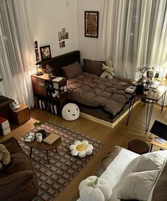 an overhead view of a living room with couches, coffee table and other furniture