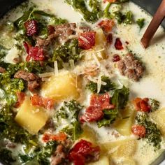 a bowl of soup with meat, broccoli and cheese