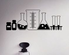 the wall decals are designed to look like laboratory beaks and flasks