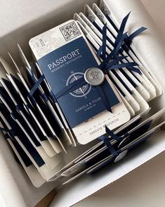 a box filled with lots of white and blue items next to each other on top of a table