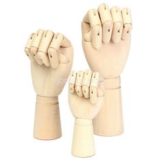 two wooden hand puppets with fingers raised in the air