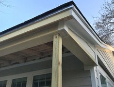 the corner of a house with siding on it