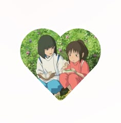 two people sitting in the shape of a heart