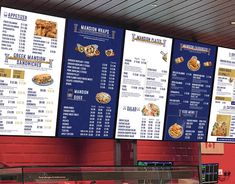 the menus are hanging up in front of the restaurant's large screen display