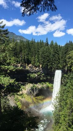 Waterfall with a rainbow at the bottom and trees around the top underneath a blue sky with clouds Spring Season Aesthetic Nature, Hiking Canada Aesthetic, Vancouver Nature Aesthetic, Summer In Canada Aesthetic, Summer Canada Aesthetic, Canada Nature Aesthetic, Canada Vibes Aesthetic, Life In Canada Aesthetic, Summer Aesthetic Canada