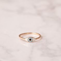 14k Solid Gold Enamel Evil Eye Ring, Dainty Turkish Eye Ring is Great Gift For Her. Stackable Evil Eye Minimalist Gold Ring. The Perfect Protection From Evil Eye Minimalist Gold Ring is agift for mom or new mom gift Material: Real Solid Gold( not plated) Karat: 14 K (585) or 18K (750) Eye Size : 5.00 mm x 11.00 mm Default Color : Rose Gold Default Ring Size : 6.50 US/CA This 14K Plain Gold Evil Eye ring in default color is shipped in the first working day after payment received. According to selected gold color, shipment date may extend 1-2 days.    M o r e  *  F r o m  *  U s   Goldstore Jewelry - https://etsy.me/3gHtcrZ * Editor's Pick - https://etsy.me/3CCLlmm * Evil Eye Necklace - https://etsy.me/3w1EdyD * Evil Eye Bracelet - https://etsy.me/3w5itBU * Evil Eye Ring - https://etsy.me/3M Rose Gold Enamel Ring, Minimalist Enamel Ring Jewelry, White Enamel Minimalist Jewelry, Minimalist Enamel Rings For Gifts, Minimalist Enamel Rings For Gift, Rose Gold Enamel Wedding Rings, Yellow Gold Enamel Rings For Gifts, Enamel Yellow Gold Rings For Gift, Rose Gold 14k Enamel Ring Fine Jewelry