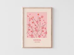 a pink poster with red flowers on it that says seoul surrounded by small branches