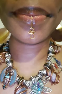 Our Ankh Lip Jewelry is a unique piece. No piercing is required. This item cannot fit into a pierced. This beautiful piece is an original design created by Eye Create LLC ™️ Lip Cuff Jewelry, African Piercings, Afrocentric Aesthetic, Create Llc, Ankh Jewelry, Lip Cuffs, Afrocentric Jewelry, Lip Jewelry, Lip Rings