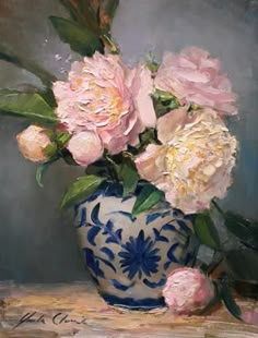 a painting of pink flowers in a blue and white vase