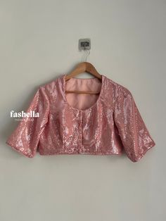 Pink sequins blouse! Please contact us if you want this sequins blouse in a different color. DETAILS * Round Neck * Non-padded * Hooks at the front for closure * Elbow length sleeves MEAUREMENTS & CUSTOMIZATIONS This blouse can be purchased in your standard sizing and pattern. Please choose your Chest Size (measured in inches) from the drop-down box.  For custom sizing please include the below measurements in the notes when you place the order.  * Shoulder: * Chest size: * Waist size: * Blouse L Long Sleeve Party Blouse With Sequins, Party Long Sleeve Blouse With Mirror Work, Festive Long Sleeve Blouse With Sequins, Long Sleeve Blouse With Mirror Work For Party, Party Blouse With Mirror Work And Long Sleeves, Fitted Sequin Blouse For Festivals, Long Sleeve Sequined Blouse For Wedding, Festive Fitted Sequin Blouse, Pink Sequined Blouse For Festive Occasions