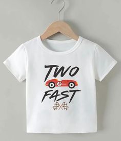 a white t - shirt with the words two fast on it and a red car