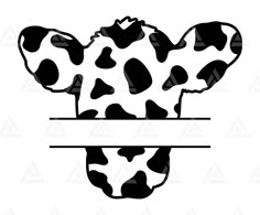 a black and white cow head with spots on it's face, in the shape of a cow