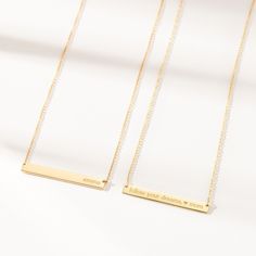 The Skinny Bar Necklace is both classic and modern. It looks great with a t-shirt or a cocktail dress. Personalize this piece with kids names, wedding dates, birthdays - the possibilities are endless, and did we mention it's reversible?! available in 14k yellow, 14k rose and 14k white gold skinny bar is 1.5″ L x 3/16″ W and is reversible back text lowercase font and center aligned only (25 characters max) to enter symbols, copy & paste from here:  +  &   /  –  .  #  °  hangs on a cable chain available in adjustable lengths of 14"-16" or 16-18".  View our necklace size guide here. Made in the USA Wedding Dates, Bar Necklaces, Wedding Song, Gold Bar Necklace, Kids Names, Rose Gold Chain, Necklace Size, Yellow Gold Chain, Copy Paste