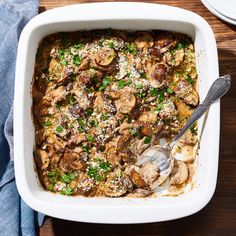 a casserole dish with mushrooms and parmesan cheese on top, ready to be eaten